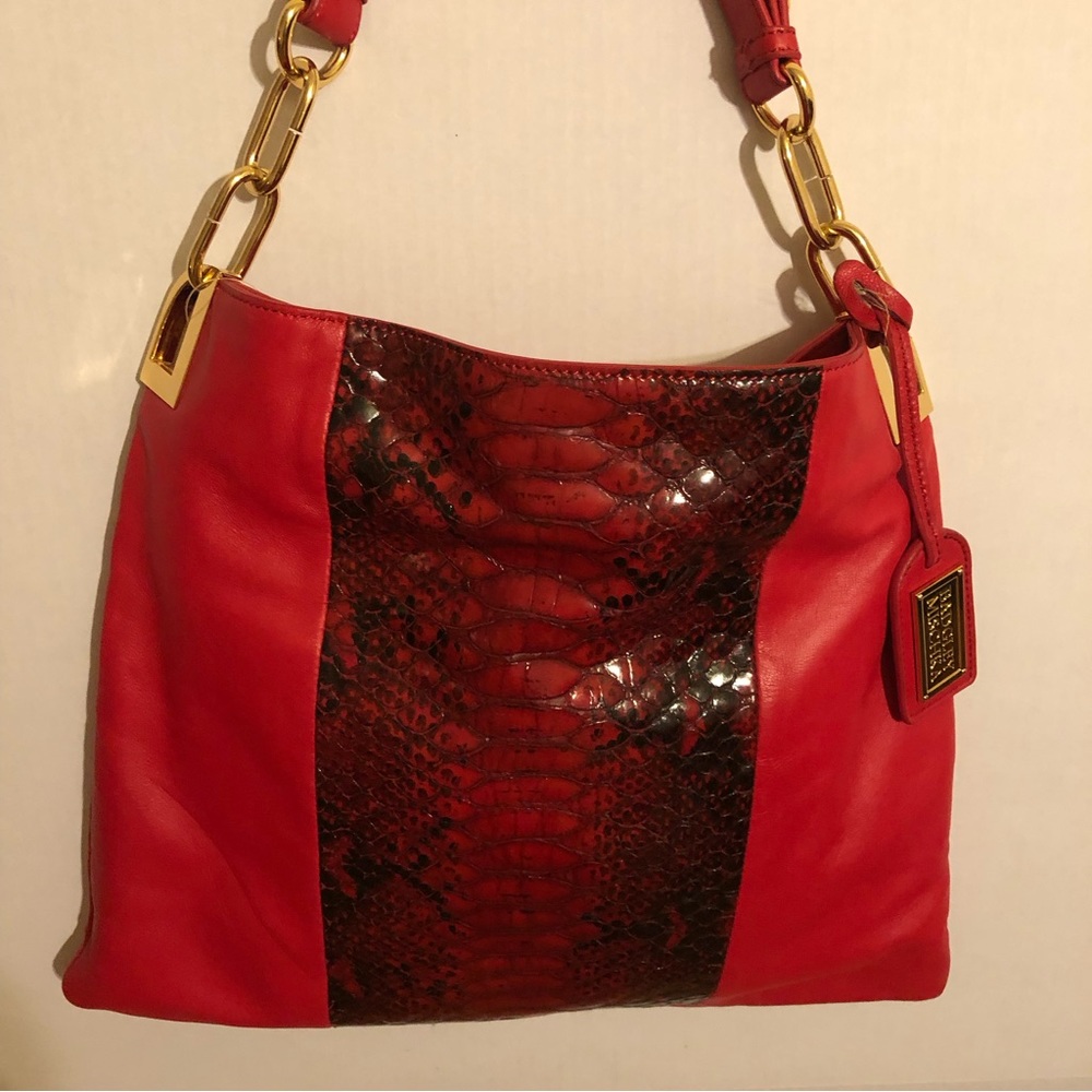 Badgley Mischka red leather purse. Faux animal panel. Adjustable strap. NWOT